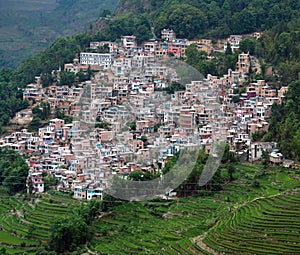 Village over terraced rice fields in Yuanyang, Yunnan Province,