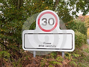 Village rectangle sign with 30 miles per hour speed limit