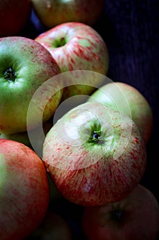 The village of ripe, fresh apples on the vertical photos