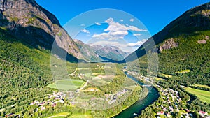 Village, river and mountains natural landscape aerial drone photography Norway in summer.
