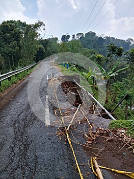 Village roads damaged by landslides caused by heavy rains.