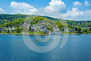 Village Rurberg at Eifel National Park, Germany. Scenic view of lake Rursee and houses in the background