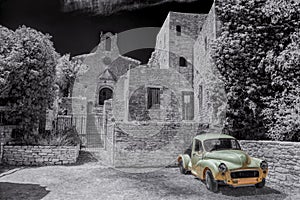 Village of Saignon with old car against church in the Luberon, Provence, France