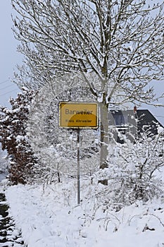 village sign of Barweiler the Eifel with snowy trees around