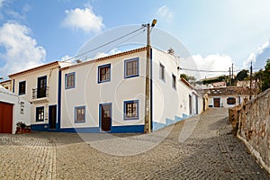 Village street with residential buildings in the town of Bordeira near Carrapateira, in the municipality of Aljezur