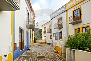 Village street with residential buildings in the town of Bordeira near Carrapateira, in the municipality of Aljezur in the Distric