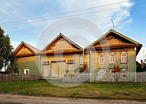 Village street in summer. Historical wooden house. Visim, Russia