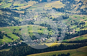 Village in sunlit valley