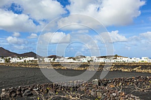 Village of Tinajo with volcanoes of Timanfaya national park