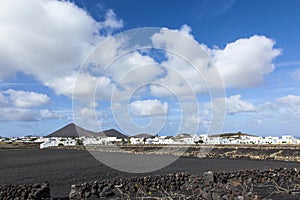 Village of Tinajo with volcanoes of Timanfaya national park