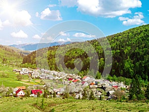 The village to the gorge, mountains covered with the green wood