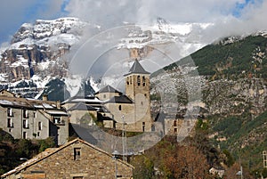 The Village Torla (Pyrenees) next to the snowy mountains