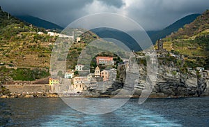 Village of vernazza at the edge of the cliff Riomaggiore, Cinque Terre, Liguria, Italy