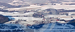 The village of Wambierzyce located in a mountain valley, winter panorama from a viewpoint