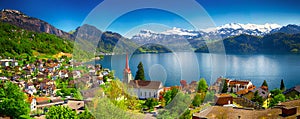 Village Weggis and lake Lucerne surrounded by Swiss Alps