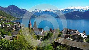 Village Weggis, lake Lucerne Vierwaldstatersee, Pilatus mountain and Swiss Alps in the background near famous Lucerne Luzern c