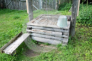 The village well is a closeup on a summer