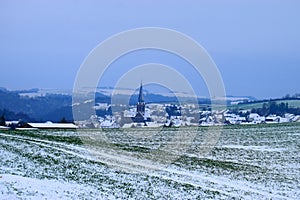 village Welling with snowy landscape in the Eifel photo