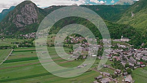 Village wooden houses aerial panorama against mountains