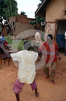 Villagers dancing to music, Uganda