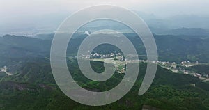 The villages in the distance loomed, Around  Danxia Landform, in Cloudy Day