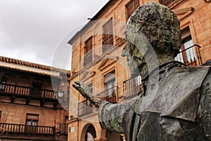 Villanueva de los Infantes square and Don Quixote statue in the foreground photo