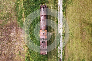 Villarcayo, Spain - June 10, 2020: Old train cemetery. Aerial view of an old abandoned rusty steam train. photo