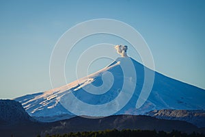 Villarrica volcano with eruptive pulse at dawn. Pucon. Chili.