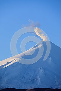 Villarrica volcano with eruptive pulse at dawn. Pucon. Chili