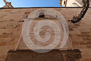 Shields on one of the facades of the Santiago Apostol church in Villena, Alicante, Spain photo