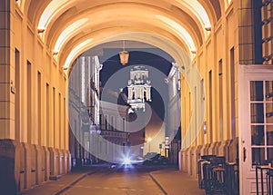 Vilnius, the capital of Lithuania at sunset, street in the historic center of the city at night