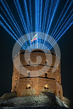 Vilnius Light Festival. Gediminas tower or castle with Lithuanian flag