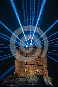 Vilnius Light Festival. Gediminas tower or castle with Lithuanian flag