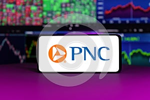 PNC financial service group on stock market index in front of stock market charts background