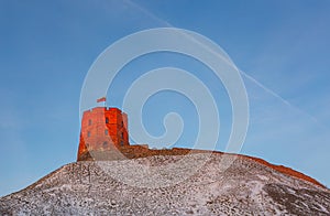 VILNIUS, LITHUANIA - DECEMBER 29: Tower of Gediminas castle in the red evening light, symbol of Vilnius city on DECEMBER