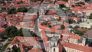 VILNIUS, LITHUANIA - JULY, 2019: Aerial drone view of the roofs in old city centre and ancient cathedrals and churches.