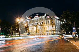 Vilnius Lithuania. Kempinski Hotel Cathedral Square In Bright Night Illumination On Universiteto Street photo