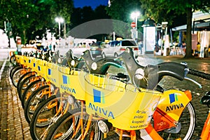 Vilnius Lithuania. Row Of Bicycles Aviva For Rent At Lit Bike Parking