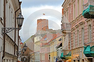 VILNIUS, LITHUANIA: View of Gediminas Hill with the colorful facades of Pilies Street in the foreground