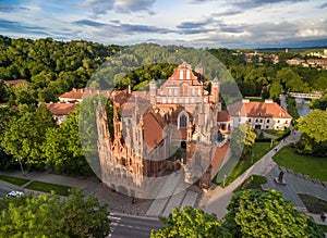 Vilnius Old Town and St. Anne Church with Hill of Three Crosses in Background. Lithuania. Sunset Time Light