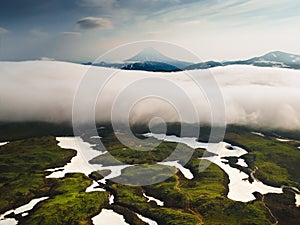 Vilyuchinsky volcano with clouds at sunrise in Kamchatka, Russia photo