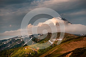 Vilyuchinsky volcano with clouds at sunset photo