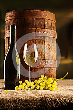 Vine composition old barrel with wineglass bottle and winegrape