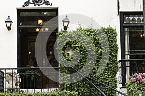 Vine covered mansion entrance