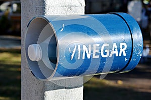 Vinegar bottle at beach