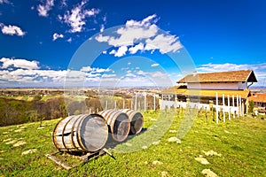 Vineyard hill landscape and wine barrels