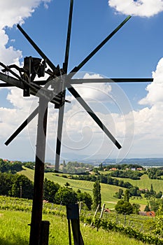 vineyard with windmill called klapotetz in south of Styria, Austria