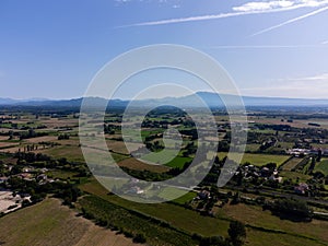 Vineyards of Chateauneuf du Pape appelation with grapes growing on soils with large rounded stones galets roules, view on Ventoux