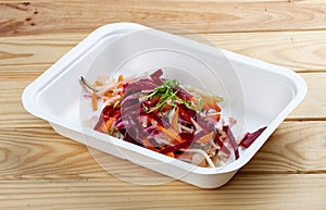 Vinigret salad. Vegetarian food. Takeaway food. On a wooden background