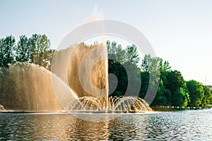 Vinnitsa, Ukraine. Dancing fountain on the river. Beautiful fountain on sunset background